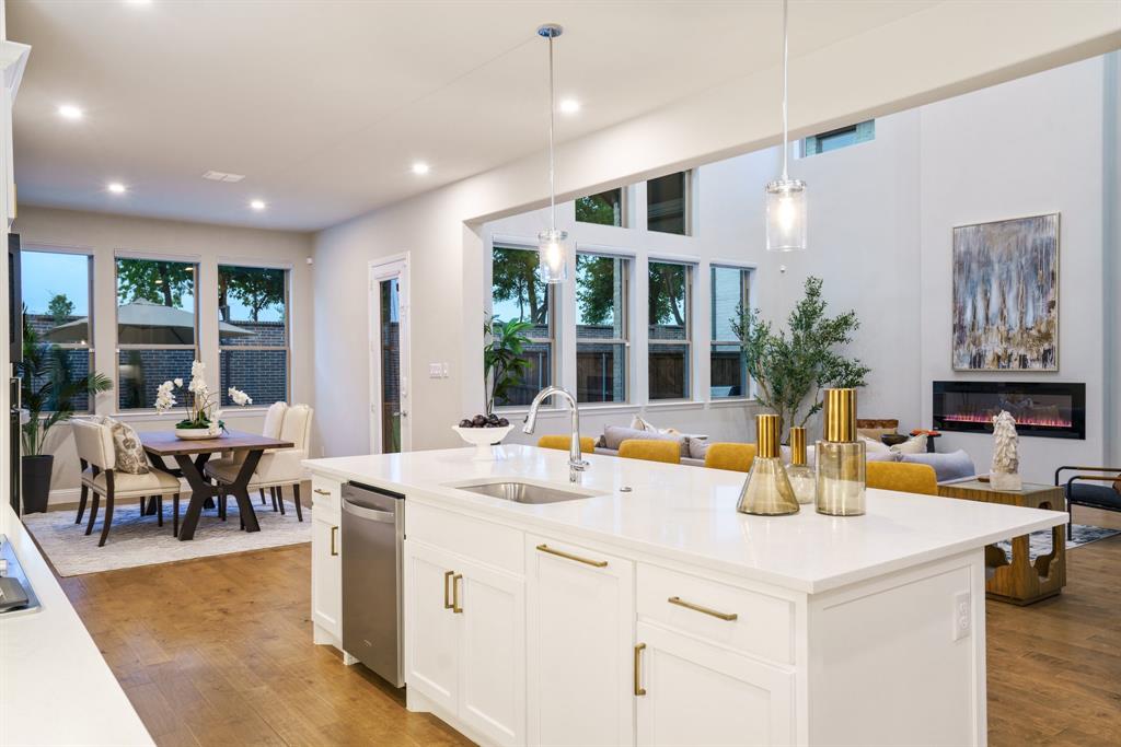 892 Panorama Drive Allen, TX 75013 - Photo 13 of 40 a view of a dining room with furniture a kitchen and chandelier