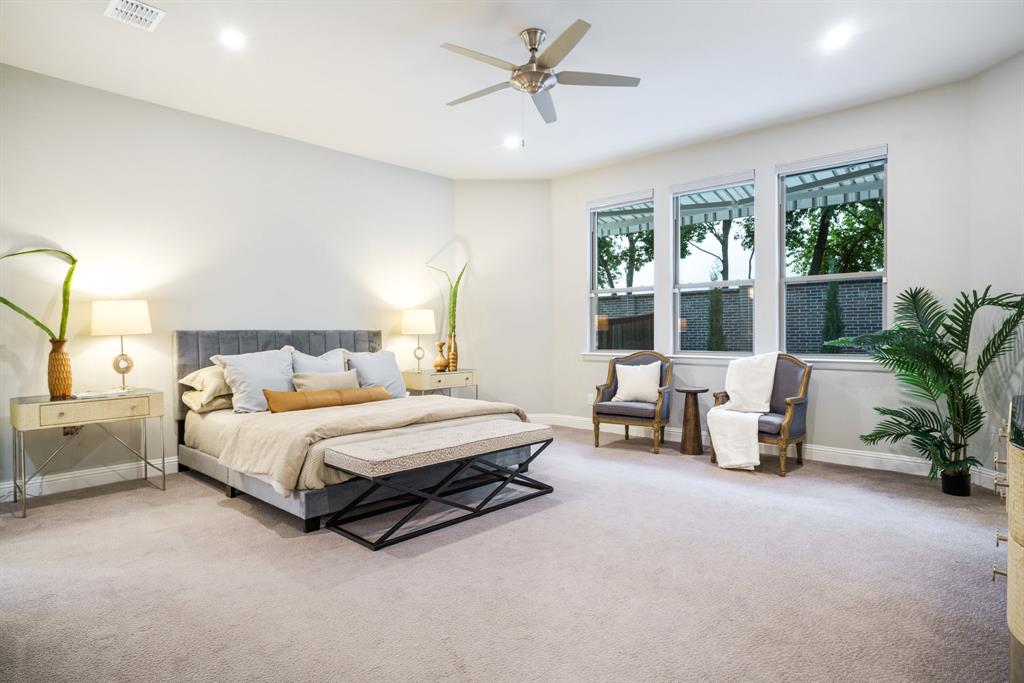 892 Panorama Drive Allen, TX 75013 - Photo 20 of 40 a spacious bedroom with a bed and a window