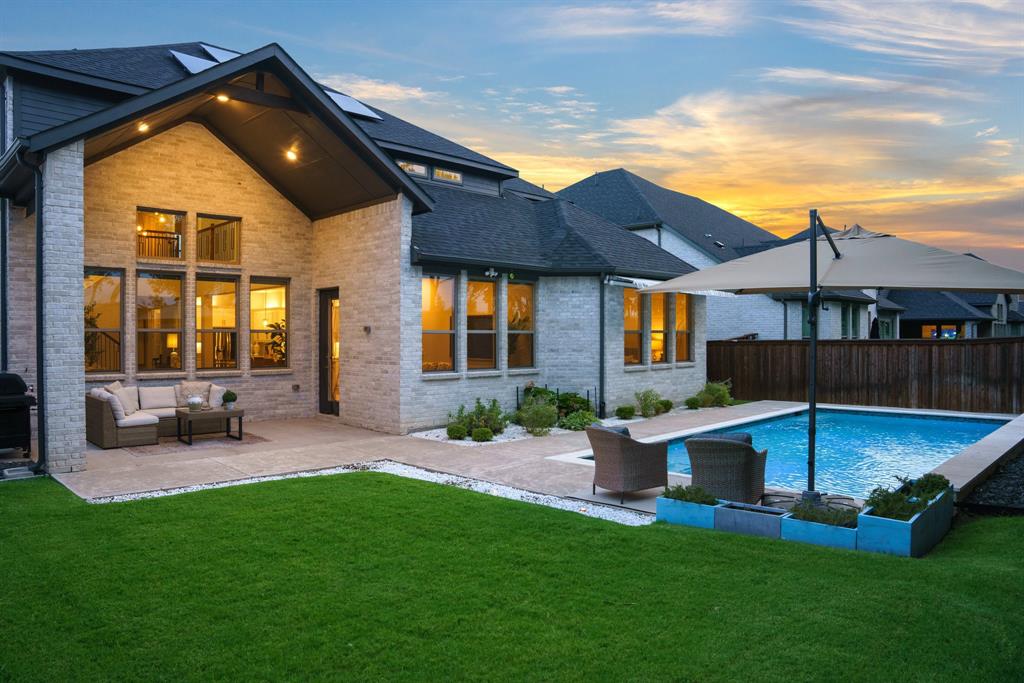 892 Panorama Drive Allen, TX 75013 - Photo 2 of 40 a view of a house with a yard patio and fire pit