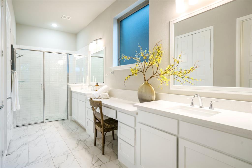 892 Panorama Drive Allen, TX 75013 - Photo 22 of 40 a bathroom with a sink and a mirror