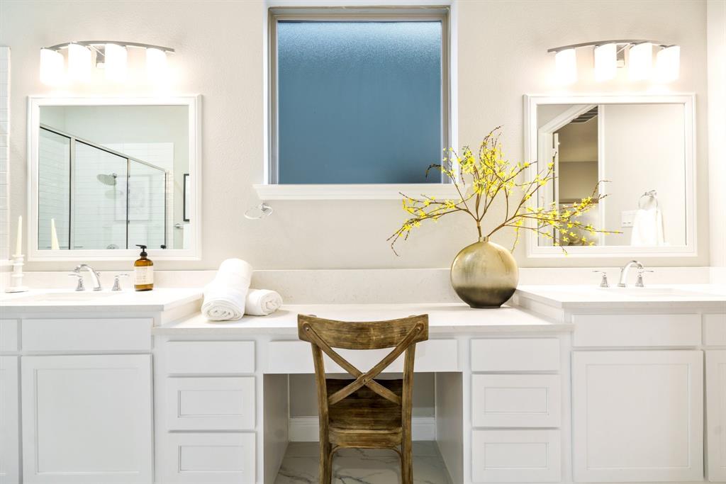 892 Panorama Drive Allen, TX 75013 - Photo 23 of 40 a bathroom with a sink and a mirror