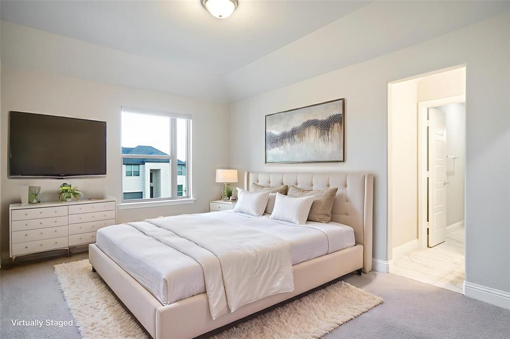 892 Panorama Drive Allen, TX 75013 - Photo 30 of 40 a bedroom with a large bed and a flat screen tv