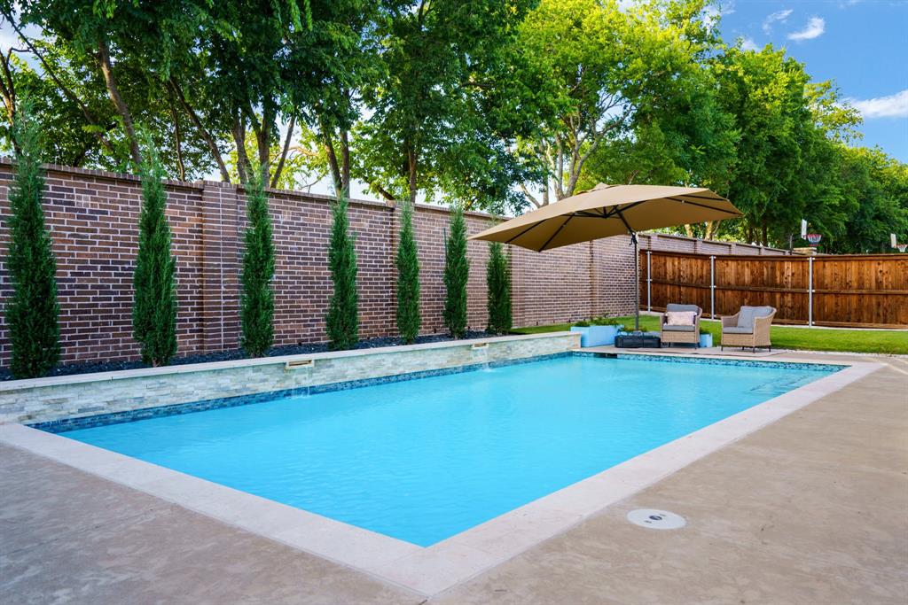 892 Panorama Drive Allen, TX 75013 - Photo 36 of 40 a view of swimming pool with an outdoor seating