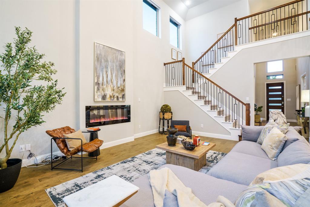 892 Panorama Drive Allen, TX 75013 - Photo 5 of 40 a living room with furniture and a potted plant