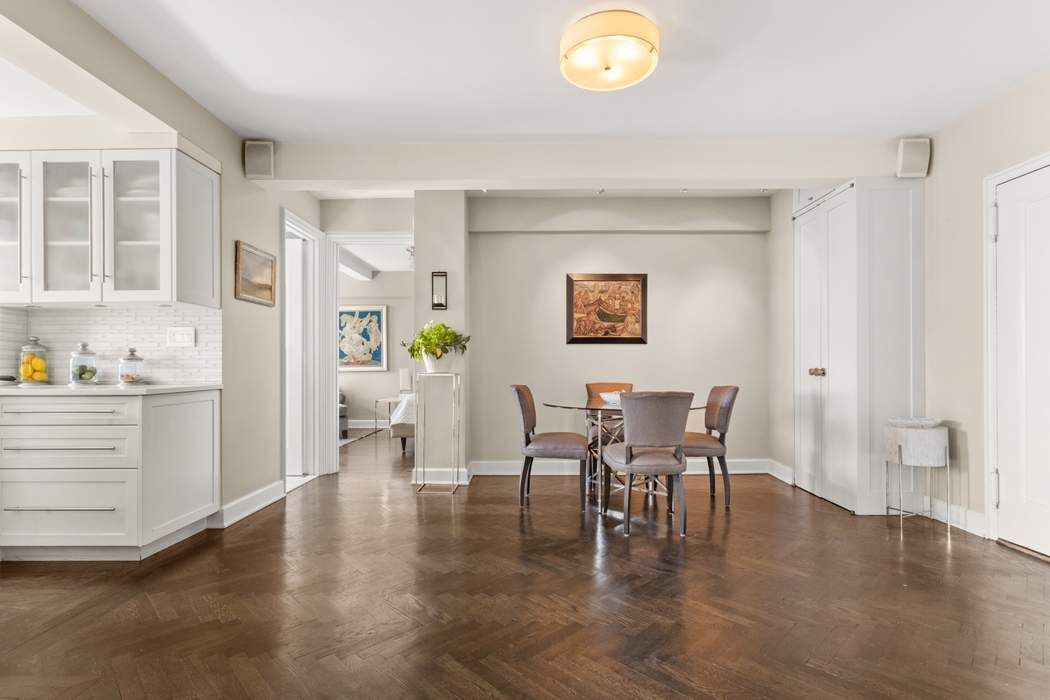 5 Riverside Drive, Unit 12B Manhattan, NY 10023 - Photo 6 of 21 a view of a dining room with furniture and wooden floor