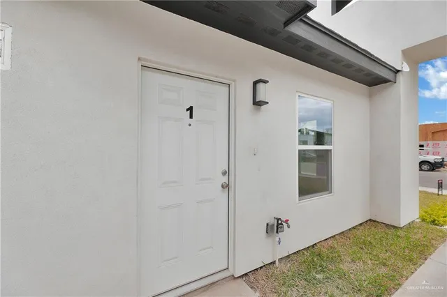 a view of a livingroom with bathroom and shower