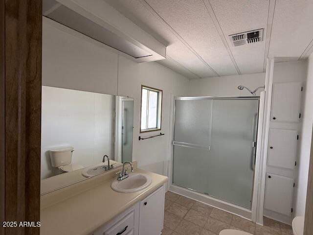 2100 North Trekell Road, Unit 97 Casa Grande, AZ 85122 - Photo 22 of 31 a bathroom with a granite countertop sink a mirror and shower