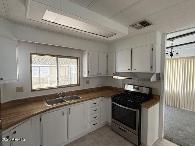 2100 North Trekell Road, Unit 97 Casa Grande, AZ 85122 - Photo 9 of 31 a kitchen with granite countertop white cabinets appliances a sink and a window