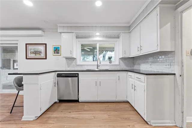 a bed room with a bed and a night stand