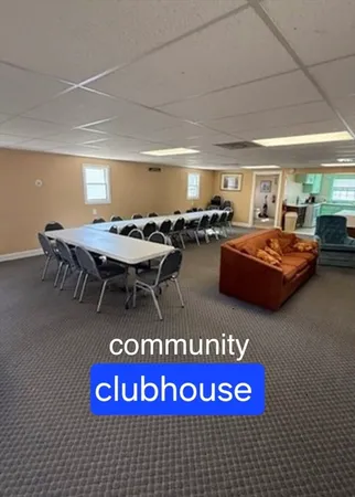 a view of hall way with furniture