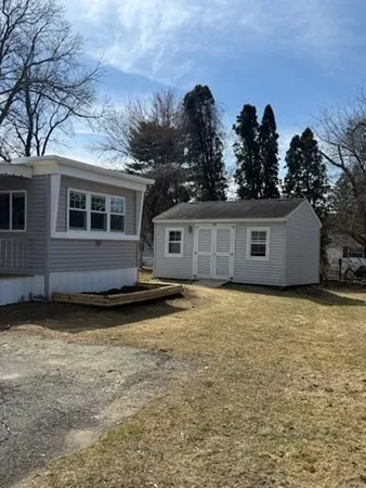 a house with trees in the background