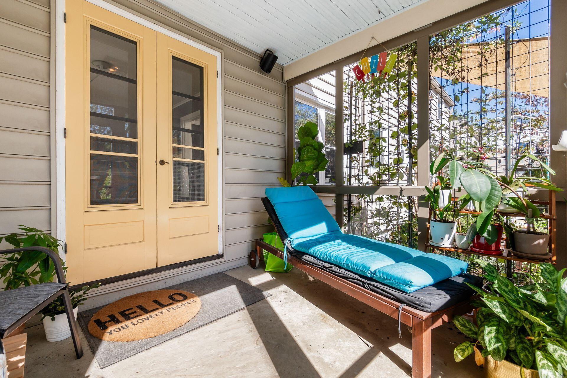 1535 Doone Road Columbus, OH 43221 - Photo 27 of 45 Screened-in porch overlooking a fenced backyard and lush gardens, perfect for relaxing, entertaining, and enjoying serene outdoor views