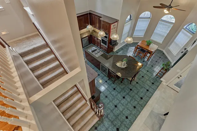 a view of living room with furniture and a fireplace