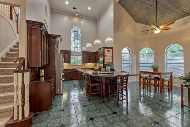 a view of a a dining room with furniture window and wooden floor