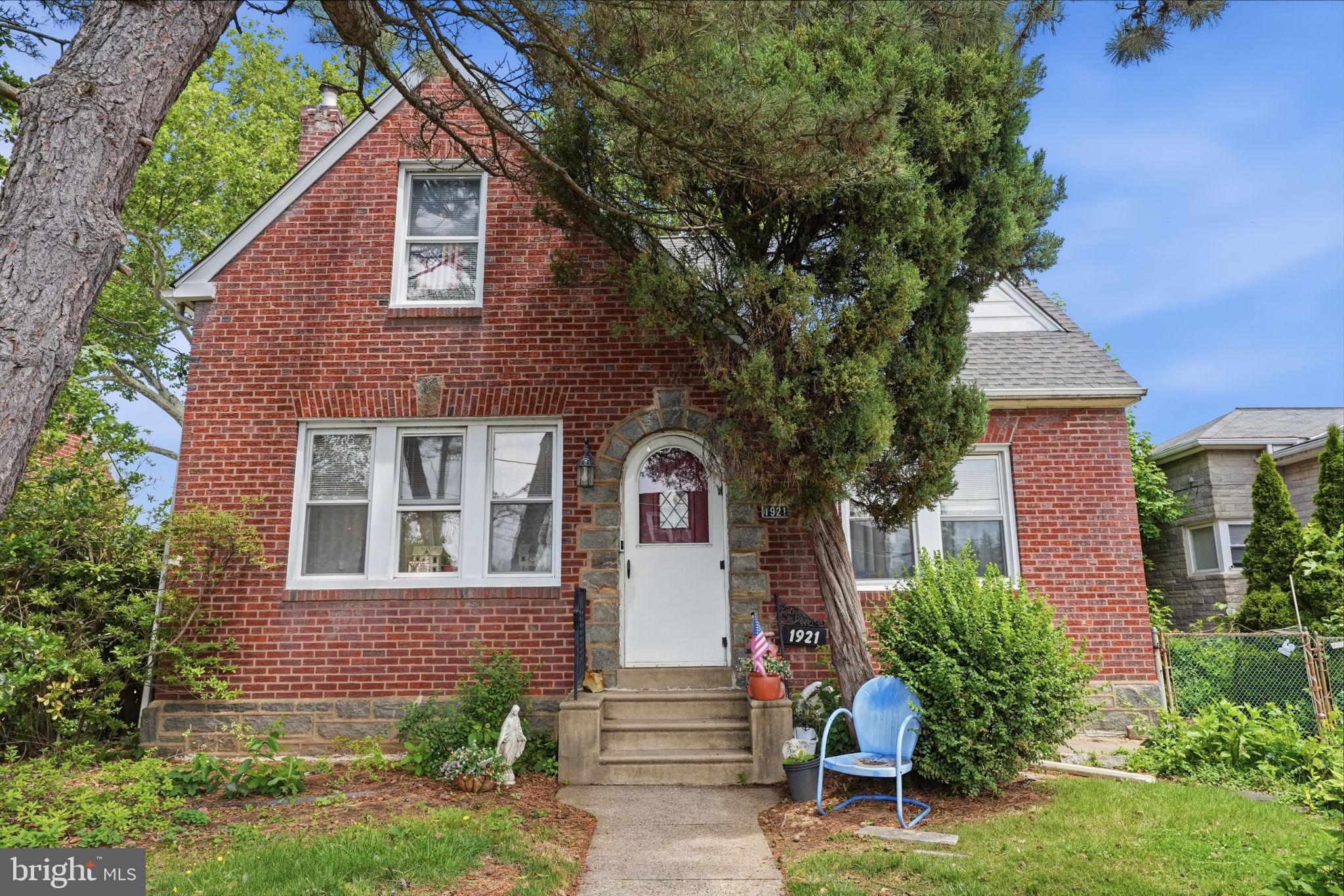 1921 Ripley Street Philadelphia, PA 19111 - Photo 2 of 38 Charming brick home with lush greenery.