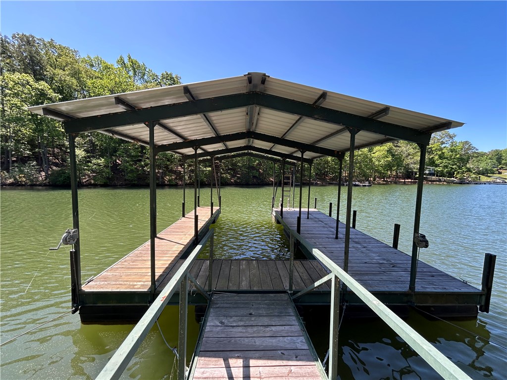 43 Sunset Cove Road Abbeville, SC 29620 - Photo 31 of 41 This private dock with covered slips offers direct water access and scenic views.