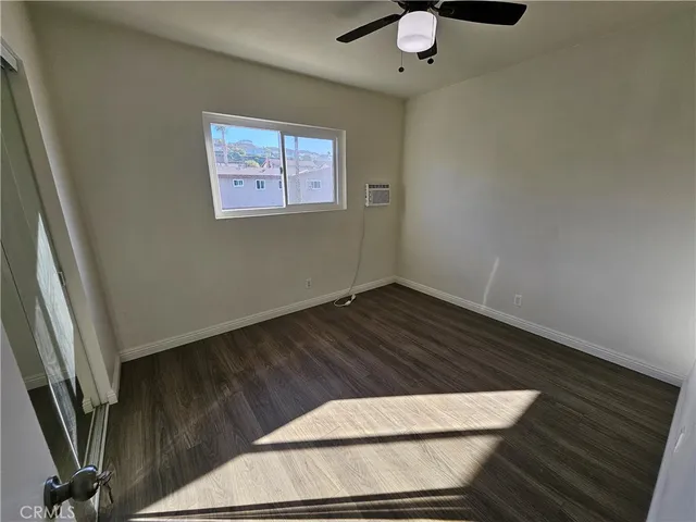 a view of staircase with wooden floor