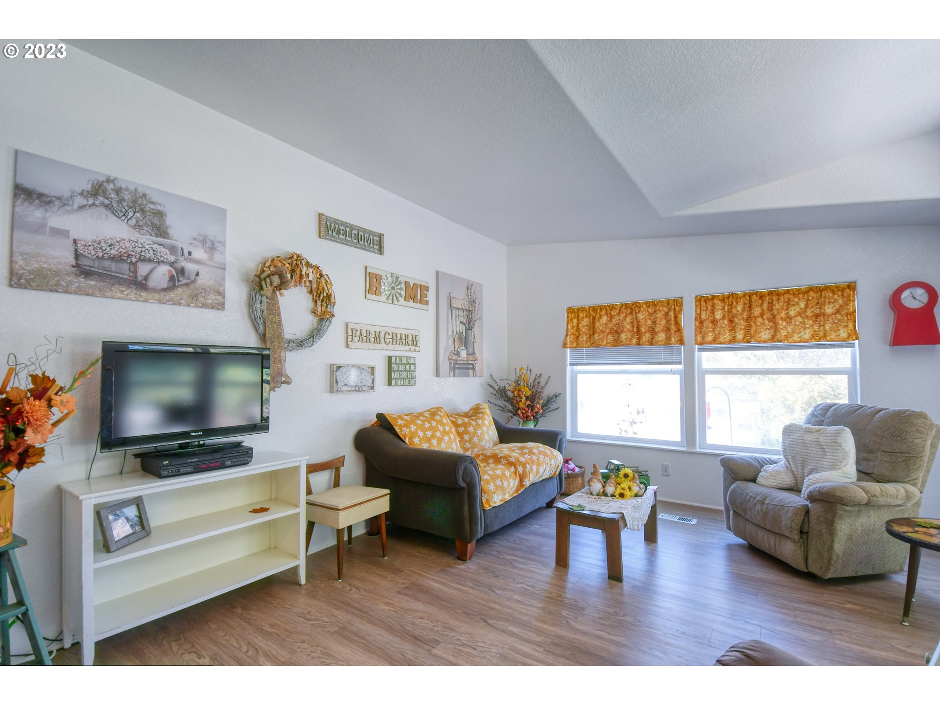 618 Northwest 6th Street Pendleton, OR 97801 - Photo 15 of 41 a living room with furniture and a flat screen tv