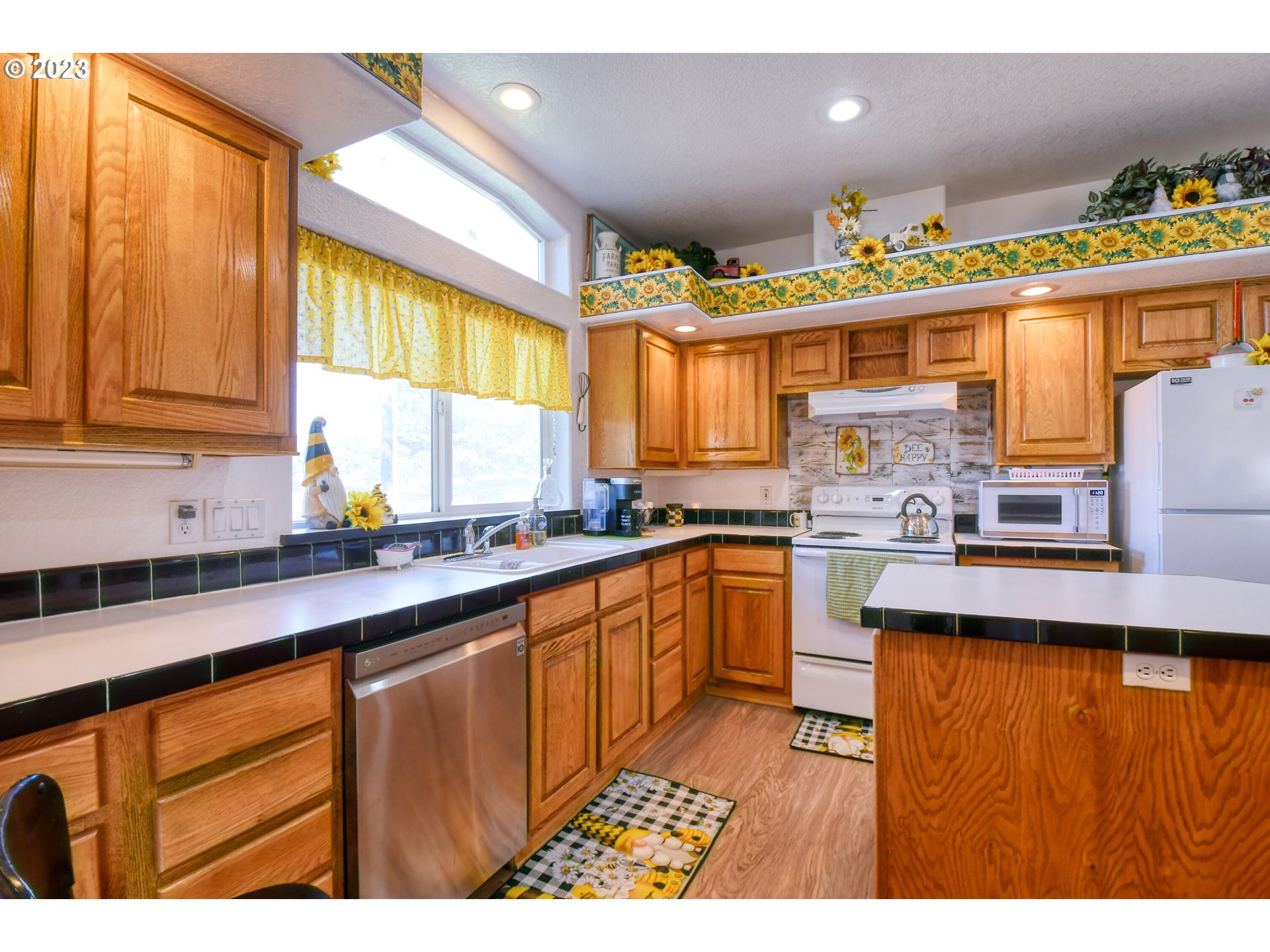 618 Northwest 6th Street Pendleton, OR 97801 - Photo 17 of 41 a kitchen with stainless steel appliances granite countertop a sink and cabinets