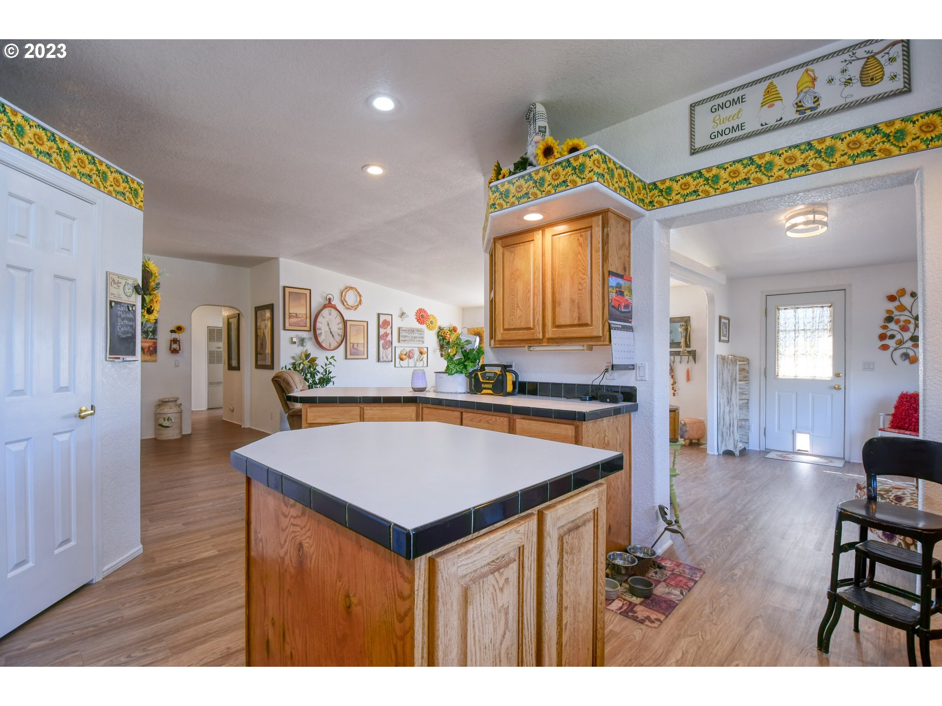 618 Northwest 6th Street Pendleton, OR 97801 - Photo 19 of 41 a view of kitchen island with cabinets and wooden floor