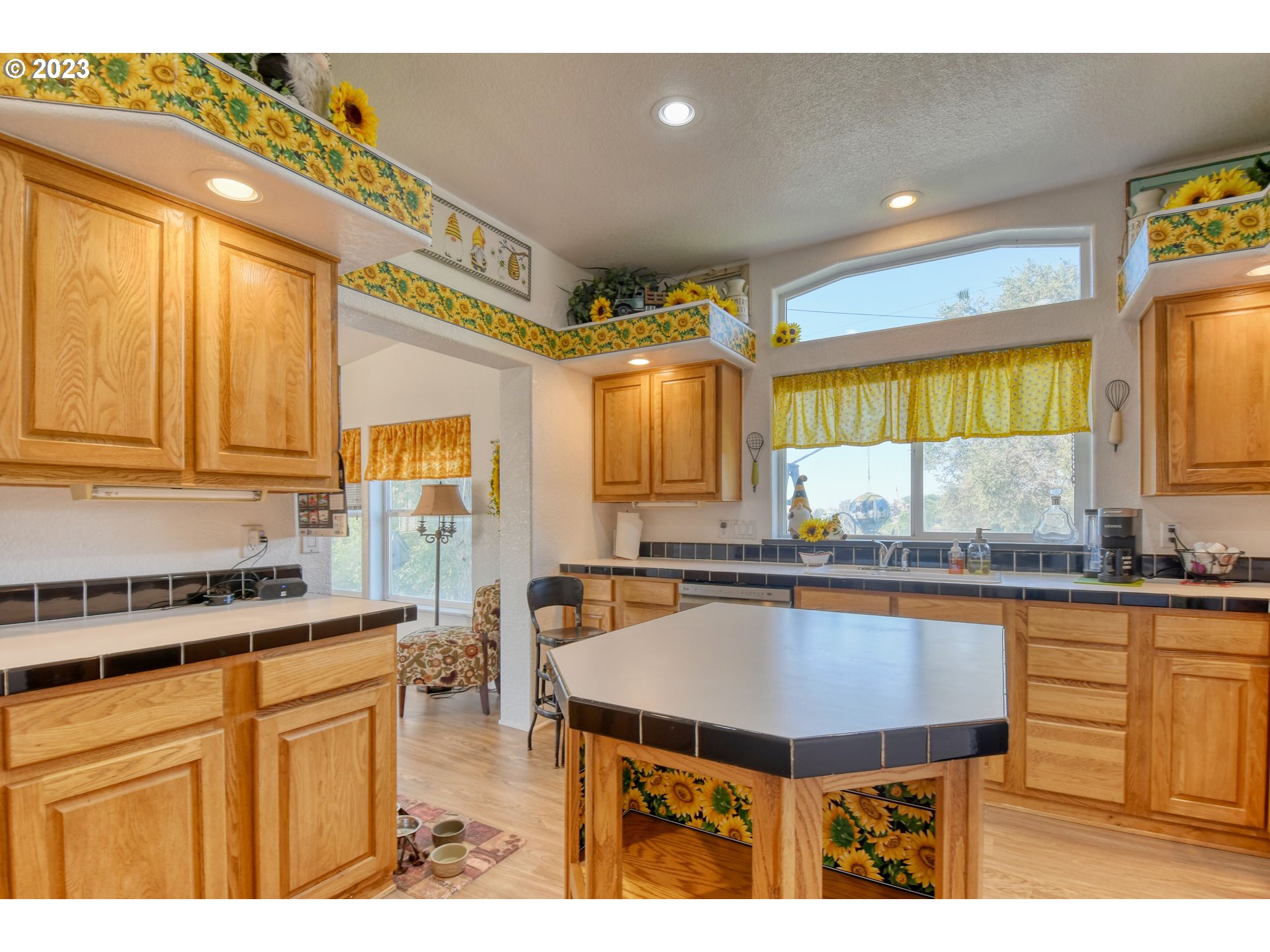 618 Northwest 6th Street Pendleton, OR 97801 - Photo 20 of 41 a kitchen with a stove a sink and a refrigerator