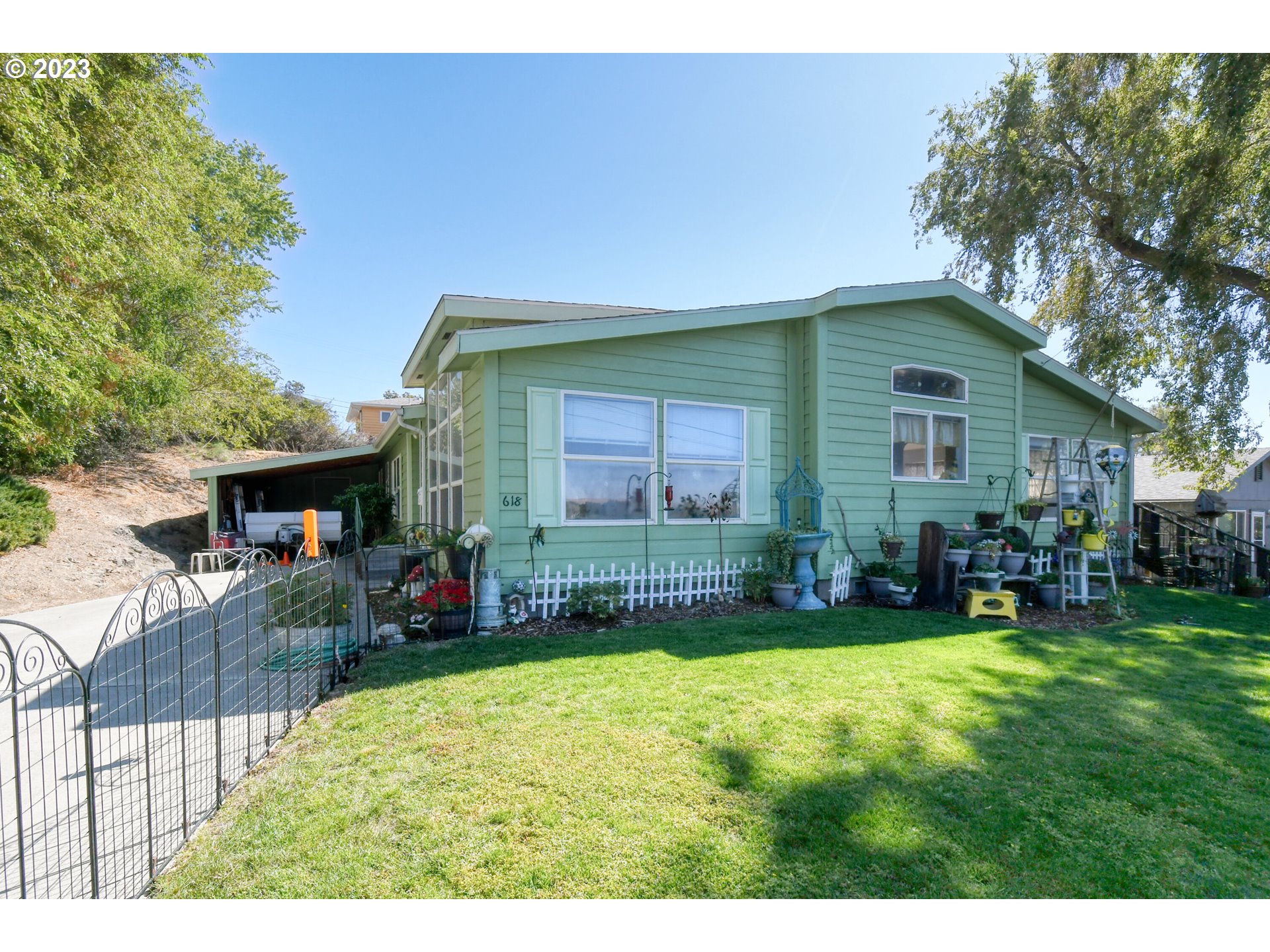 618 Northwest 6th Street Pendleton, OR 97801 - Photo 2 of 41 a view of house with backyard and outdoor seating