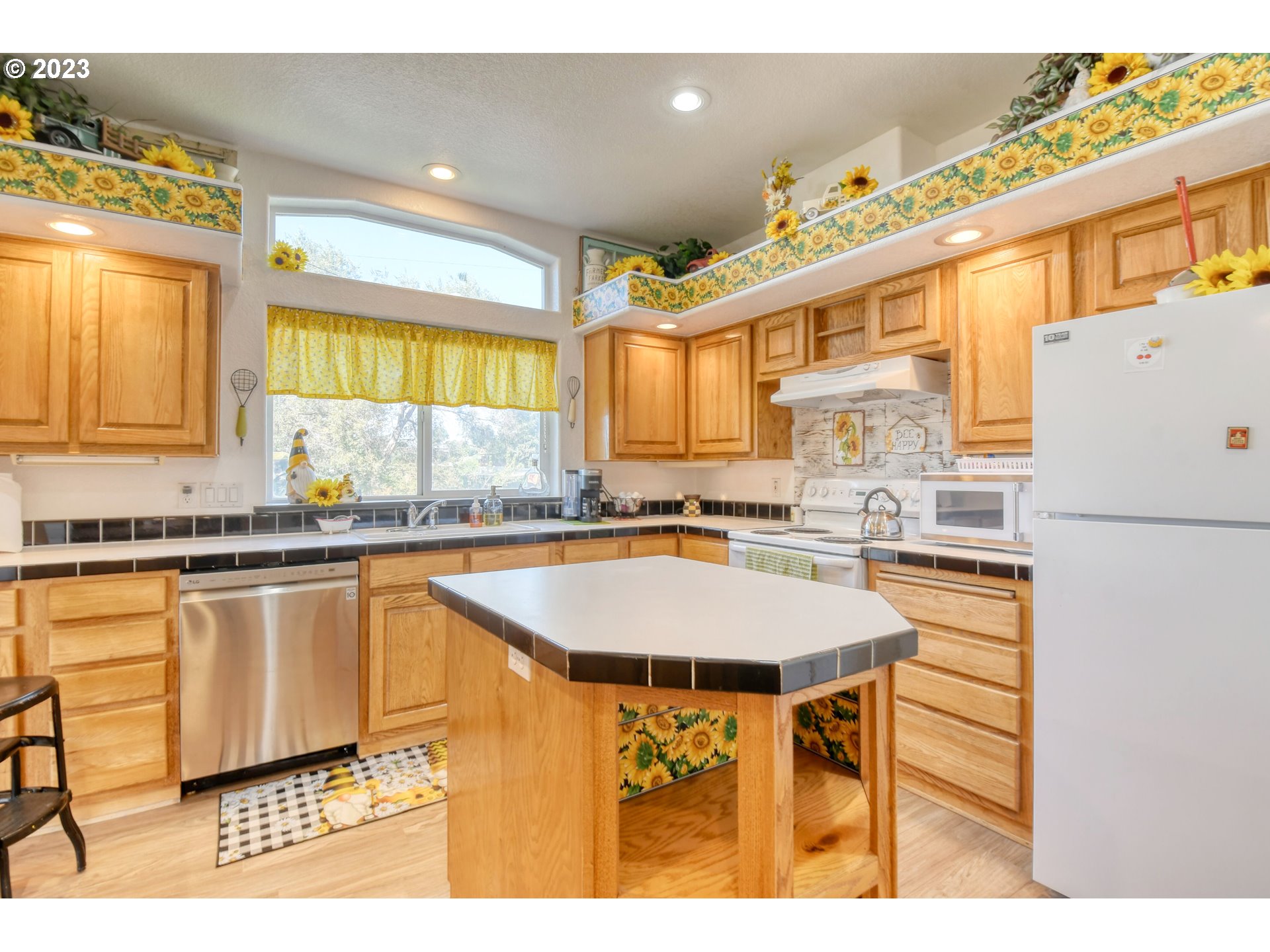 618 Northwest 6th Street Pendleton, OR 97801 - Photo 21 of 41 a kitchen with stainless steel appliances granite countertop a sink and a refrigerator