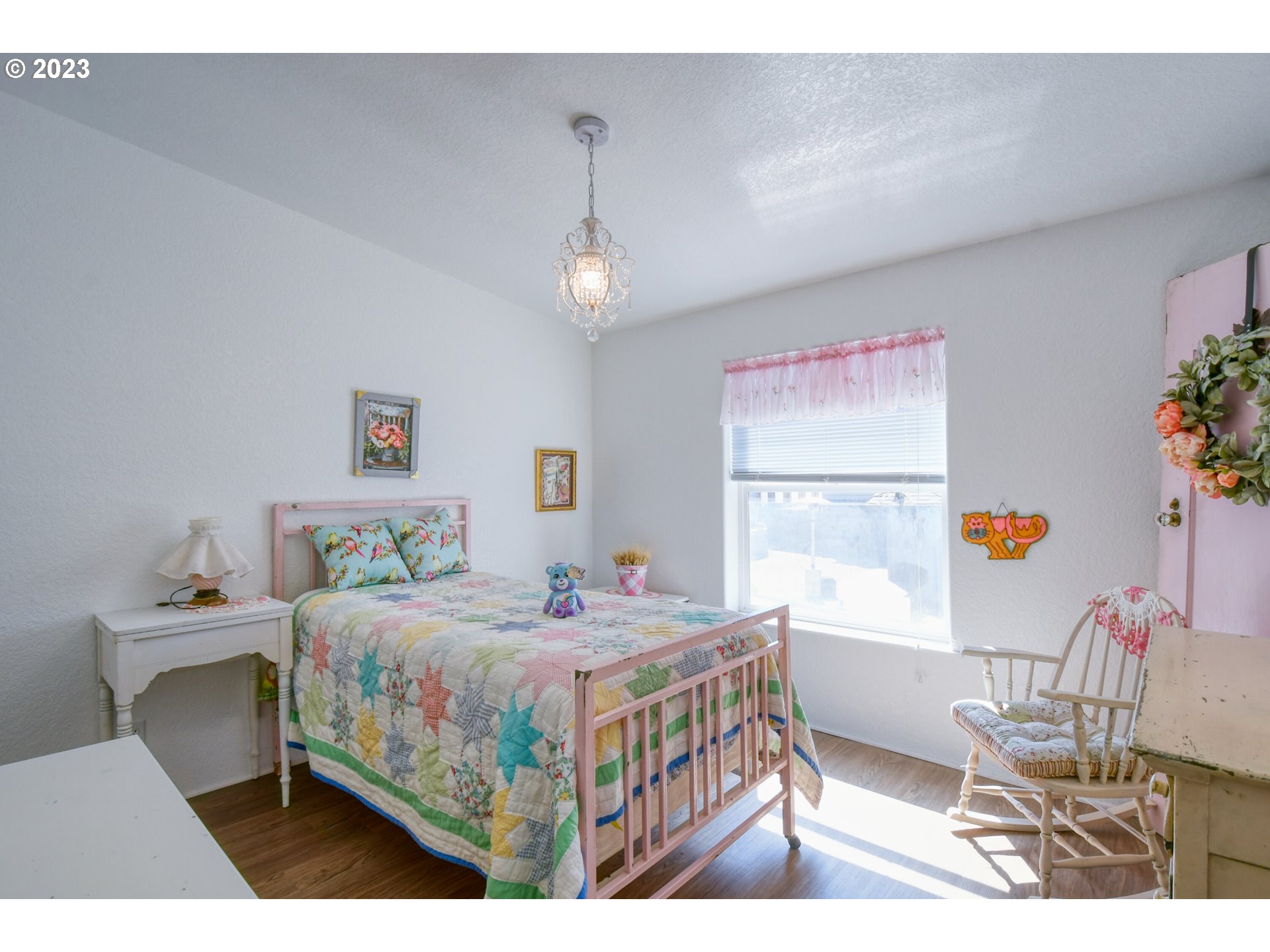 618 Northwest 6th Street Pendleton, OR 97801 - Photo 31 of 41 a bedroom with a bed and a table in it