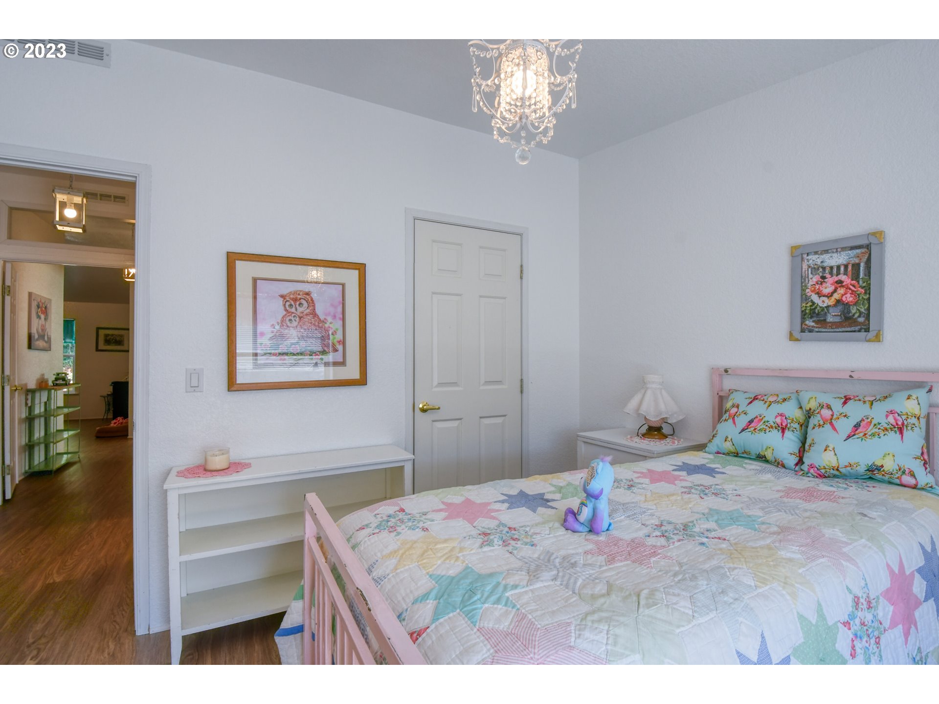 618 Northwest 6th Street Pendleton, OR 97801 - Photo 32 of 41 a bedroom with a bed and a chandelier