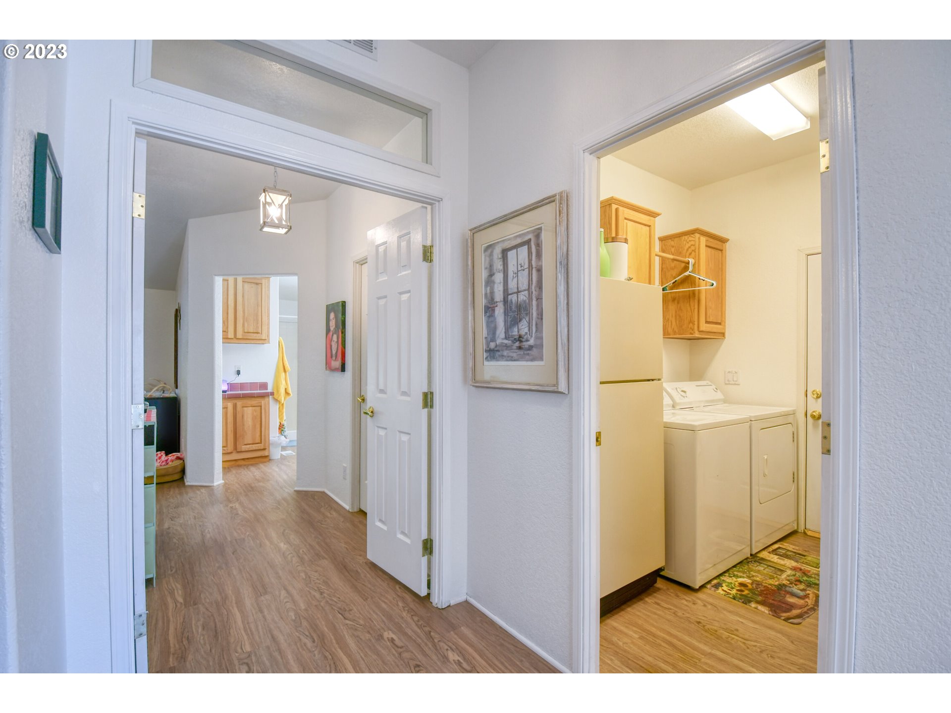 618 Northwest 6th Street Pendleton, OR 97801 - Photo 33 of 41 a view of a hallway with wooden floor and a bathroom