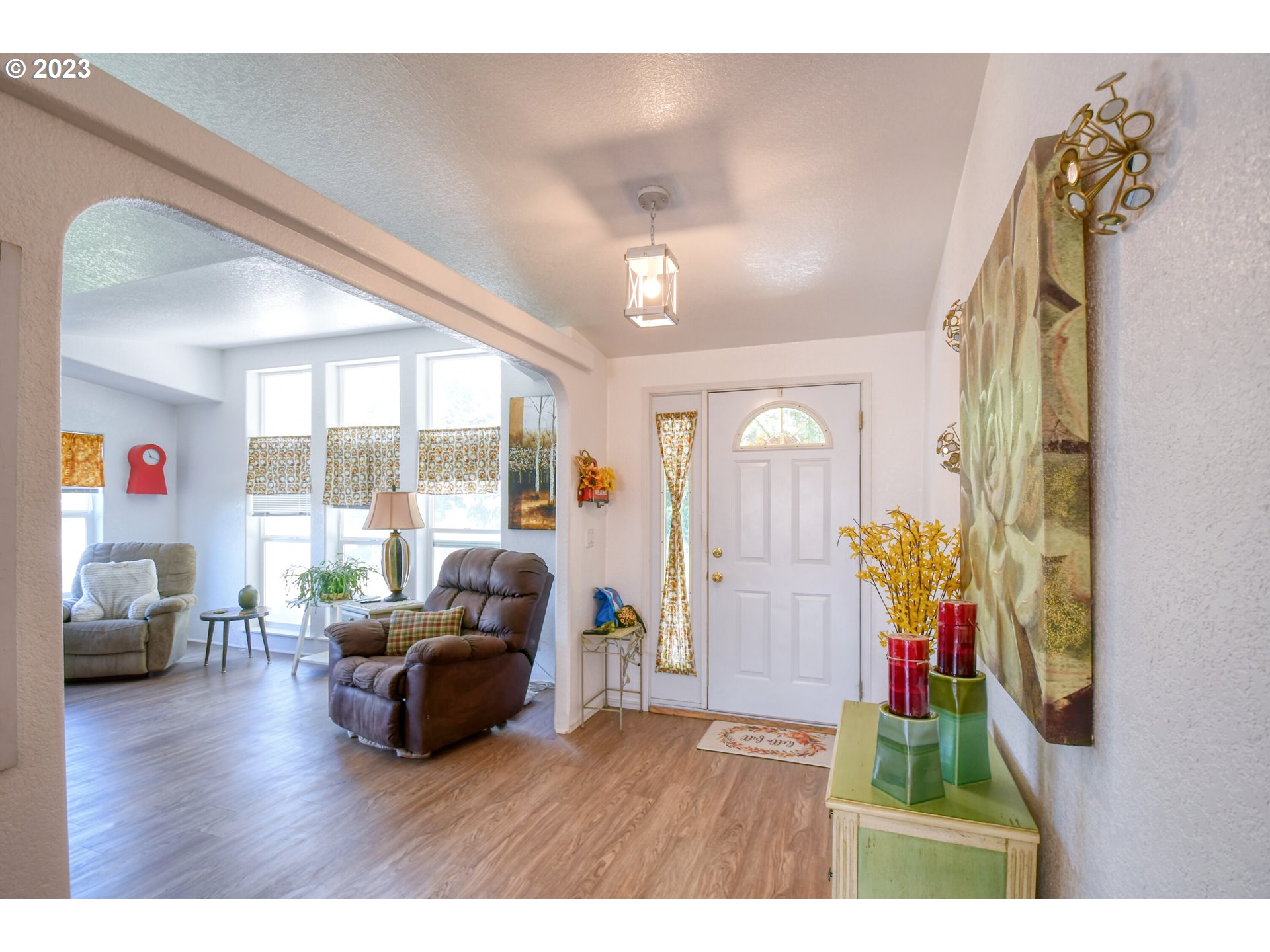 618 Northwest 6th Street Pendleton, OR 97801 - Photo 7 of 41 a living room with furniture and a flat screen tv