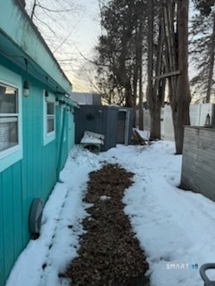 15 North Street Madison, CT 06443 - Photo 11 of 13 a backyard of a house with yard and seating area