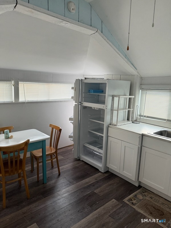 15 North Street Madison, CT 06443 - Photo 6 of 13 a view of a dining room with furniture window and wooden floor