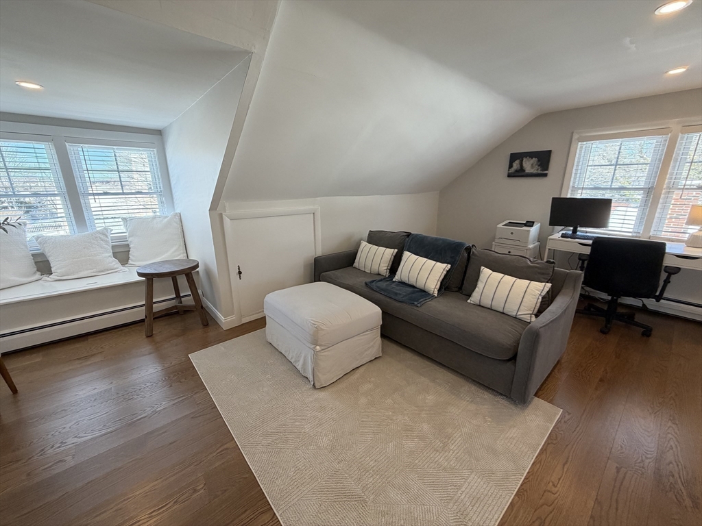 20 Smith Road, Unit SUMMER Rockport, MA 01966 - Photo 20 of 26 a living room with furniture and a wooden floor