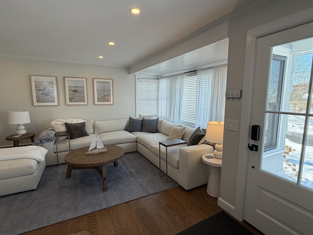 20 Smith Road, Unit SUMMER Rockport, MA 01966 - Photo 2 of 26 a living room with furniture and a window