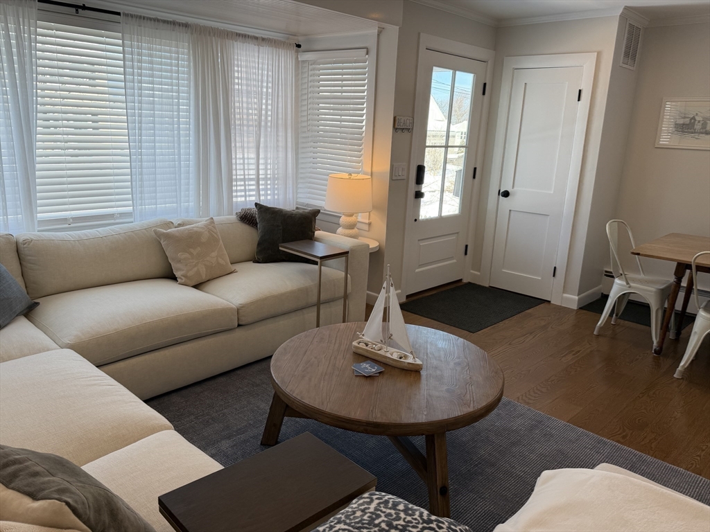 20 Smith Road, Unit SUMMER Rockport, MA 01966 - Photo 5 of 26 a living room with furniture and a wooden floor