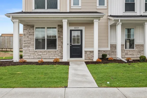front view of a house with a yard