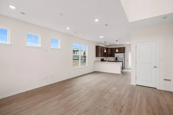a view of kitchen and wooden floor