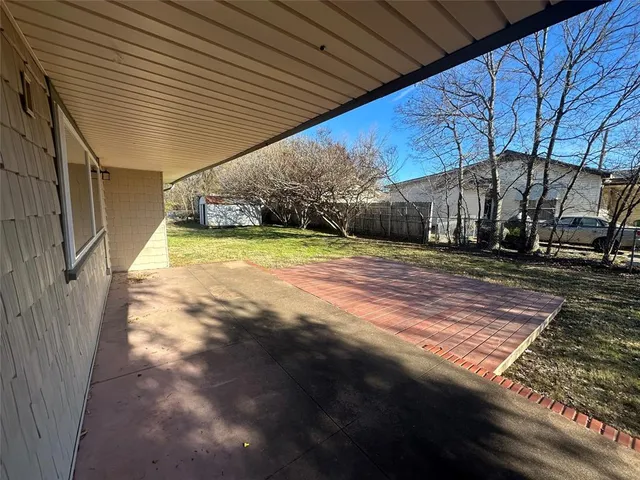 a view of a backyard of the house