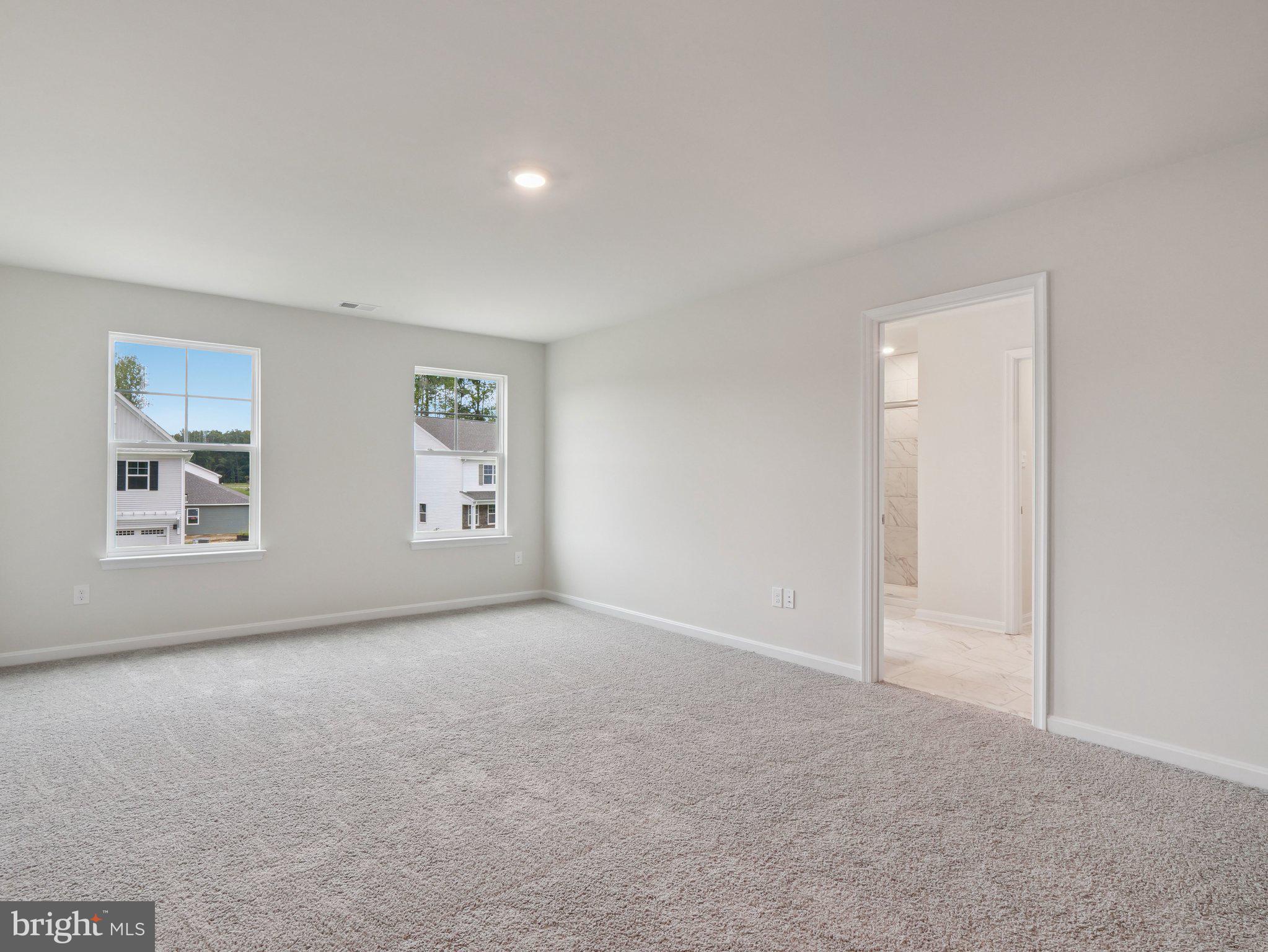 6262 Sterling Way Ruther Glen, VA 22546 - Photo 24 of 31 an empty room with windows and closet
