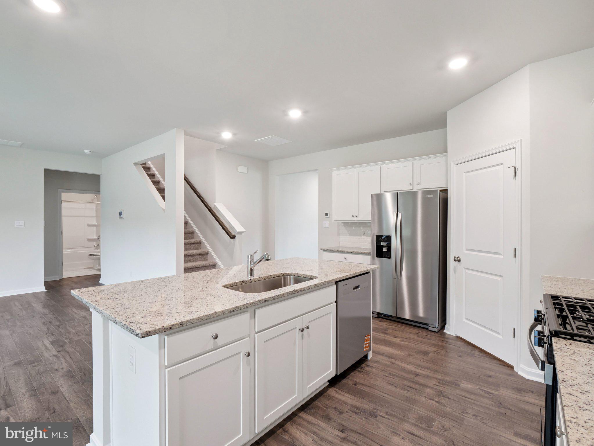 6262 Sterling Way Ruther Glen, VA 22546 - Photo 3 of 31 a kitchen with stainless steel appliances granite countertop refrigerator sink and cabinets