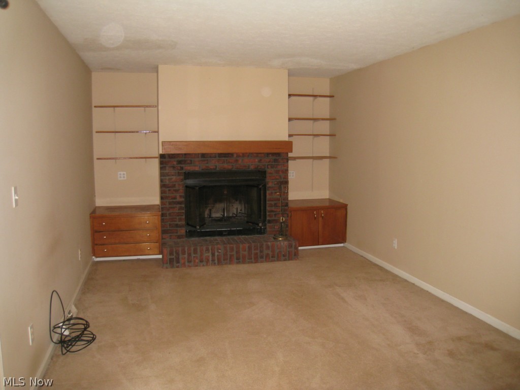 4674 Liberty Road South Euclid, OH 44121 - Photo 2 of 18 Family room with fireplace and built-ins.
