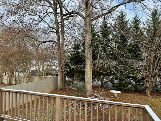 a view of a balcony with tree