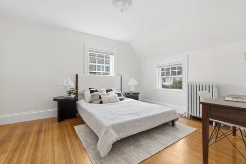 a bedroom with a bed and a table in it