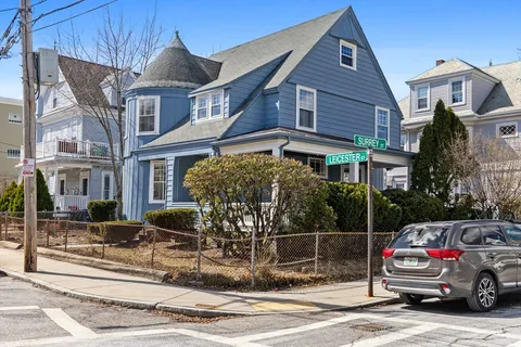 a car parked in front of a house