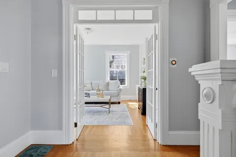 a en suite bathroom with a toilet sink and a mirror