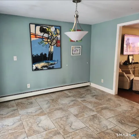 a view of a livingroom with a projector and furniture