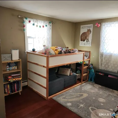 a bed room with a bed and a window