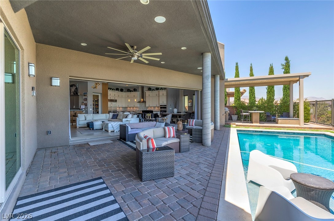 6014 Willow Ridge Court Las Vegas, NV 89135 - Photo 76 of 99 An inviting outdoor living space seamlessly connects with the interior, perfect for entertaining.
