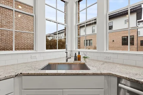 a kitchen with a sink and a window